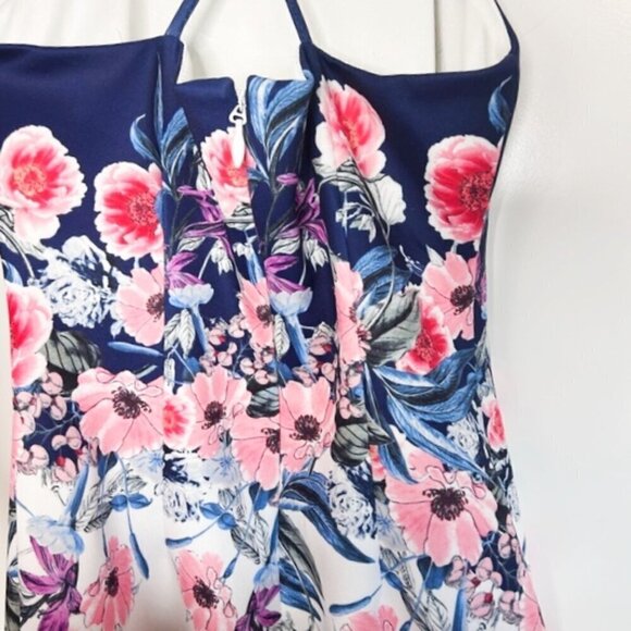 A strappy back adds allure to an apron-front bodycon dress wrapped in flowers - - Picture 5 of 5